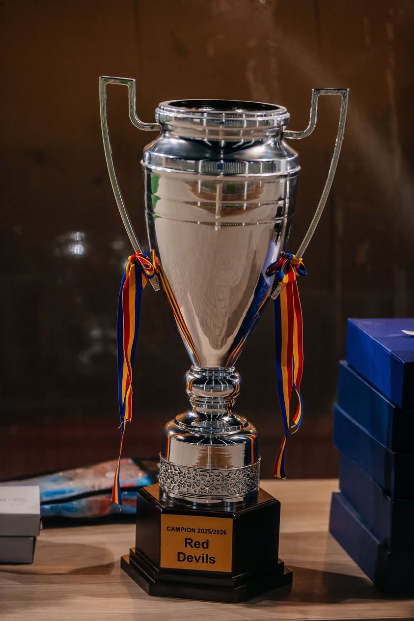 FC Red Devils championship trophy with a plaque reading Campion 2025-2026 Red Devils