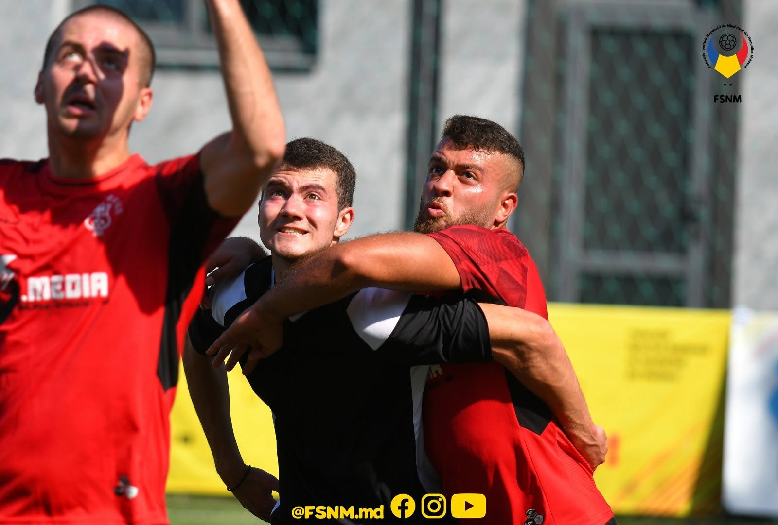 FC Red Devils players celebrating together in shirts featuring the 69 Media sponsor logo