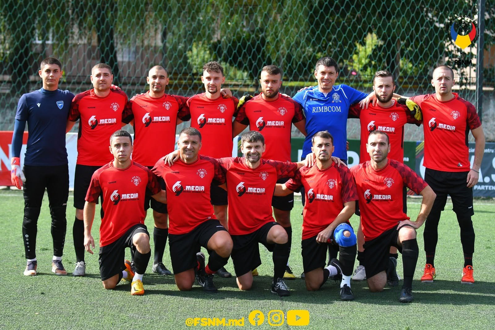 FC Red Devils full squad wearing red shirts featuring the 69 Media sponsor logo